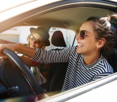 girl driving a newly insured car