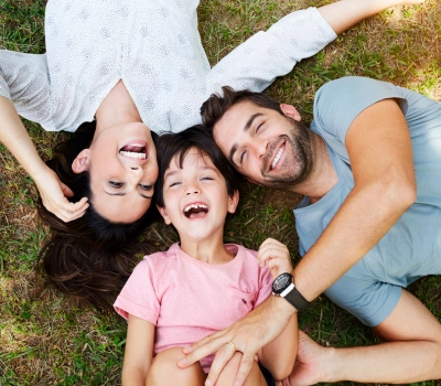 healthy family smiling for the camera