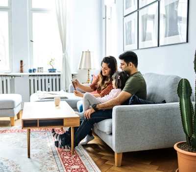 happy family seating in home's living room