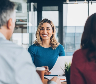 insurance agent smiling to customers at the office