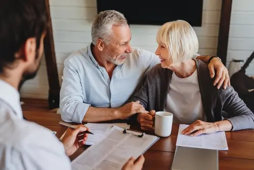 older couple reviewing health insurance with an agent